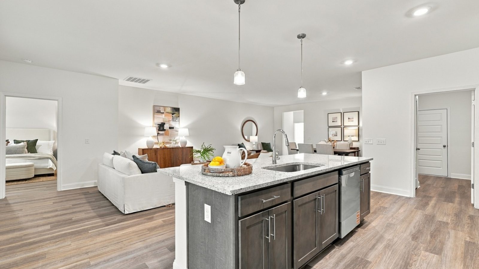 Open kitchen overlooking the spacious family room, showcasing the seamless flow of the Aberdeen E floorplan.