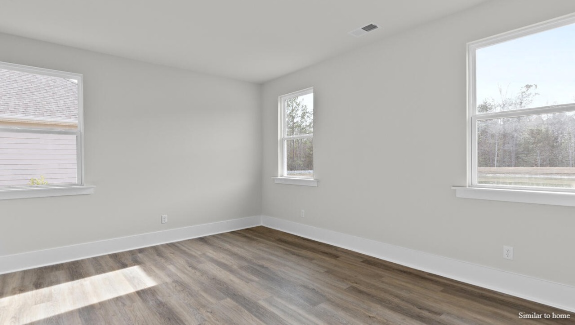 Open-concept great room in the Martin by D.R. Horton providing comfortable living and entertaining space.
