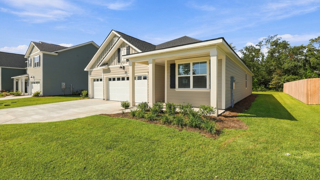 Martin F front side exterior of home in Laurel Grove community with three car garage
