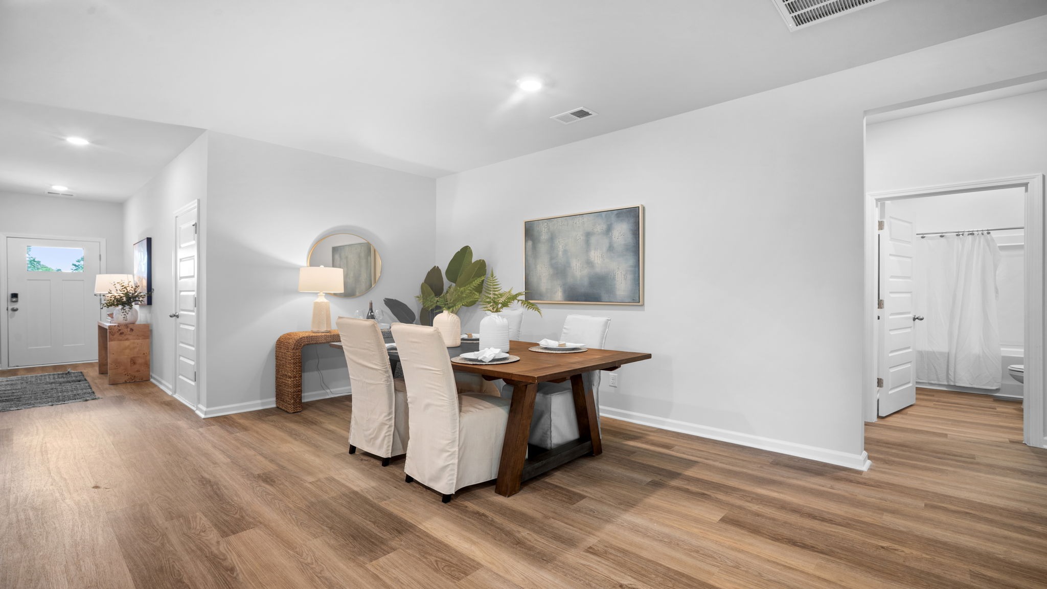 Casual dining area in Lakeside model with convenient access to kitchen island and living space