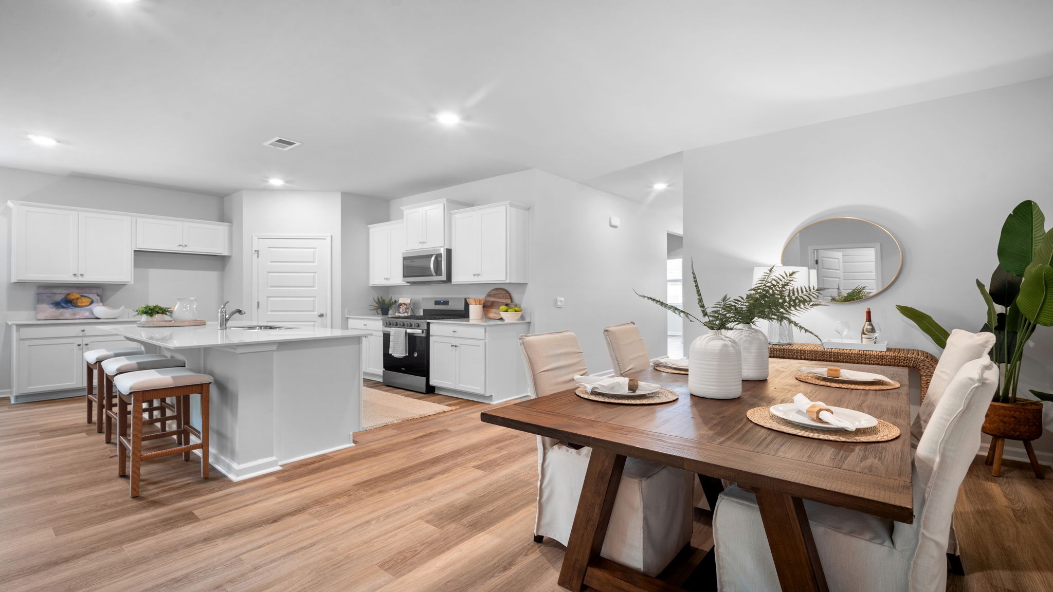 Open-concept dining room that flows into the kitchen