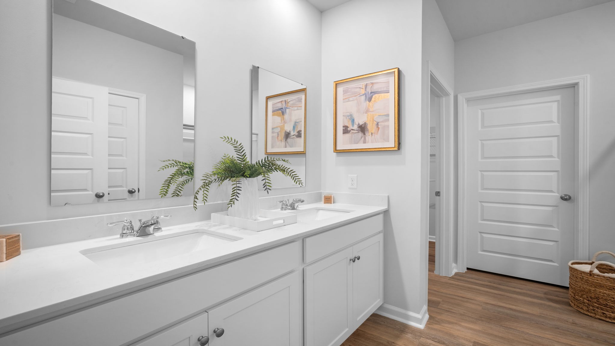 Primary bathroom in Lakeside floor plan featuring dual vanities, walk-in shower, and modern finishes for a spa-like feel