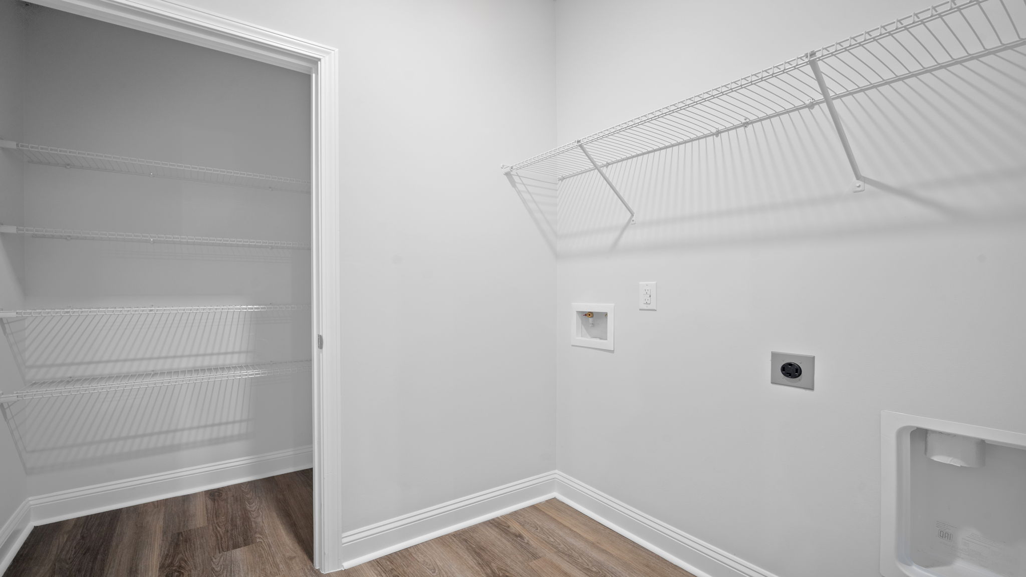 Laundry room with washer and dryer connections.