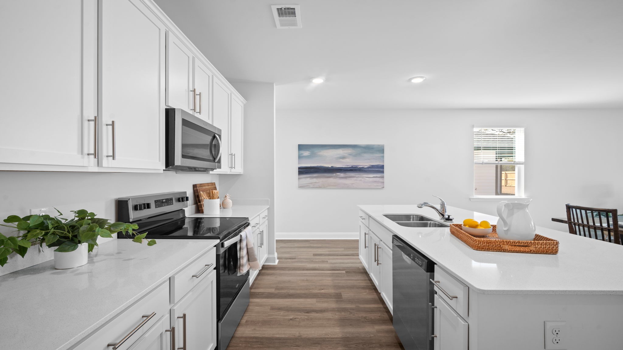 Kitchen view of both countertops looking towards the front of the home