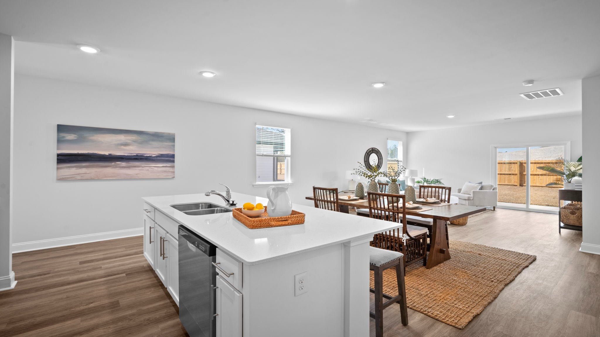 Kitchen island with view of the opposite counter and cabinets with an oven range