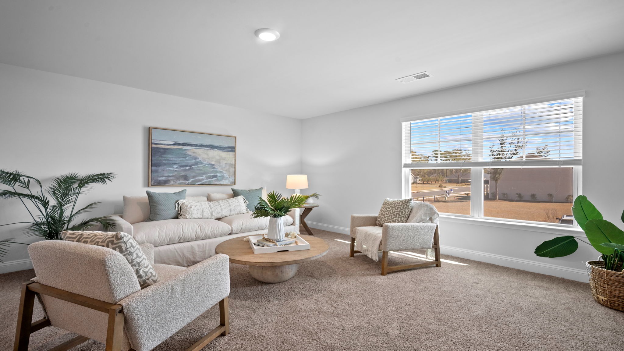 Upstairs living room decorated with seating