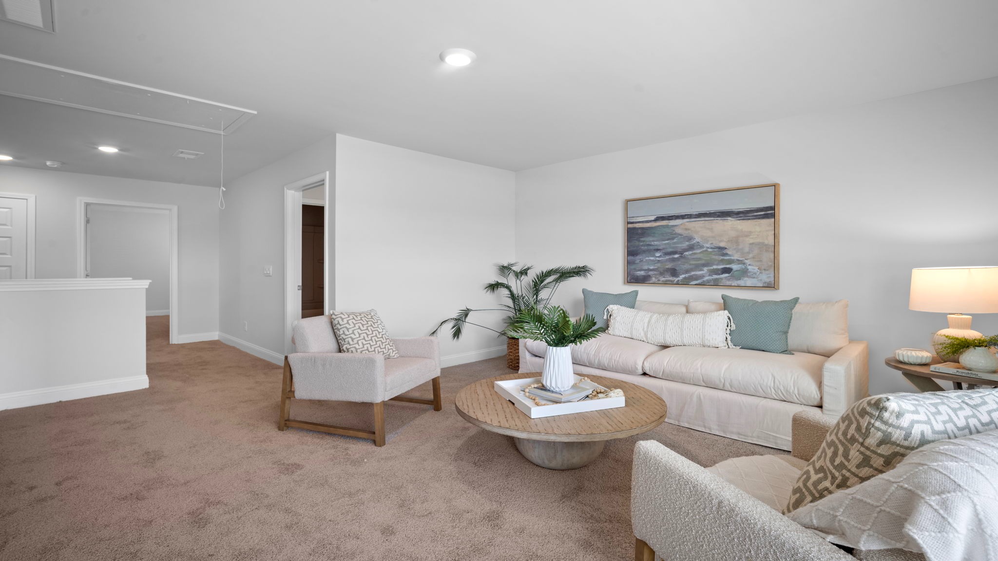Upstairs living room decorated with seating