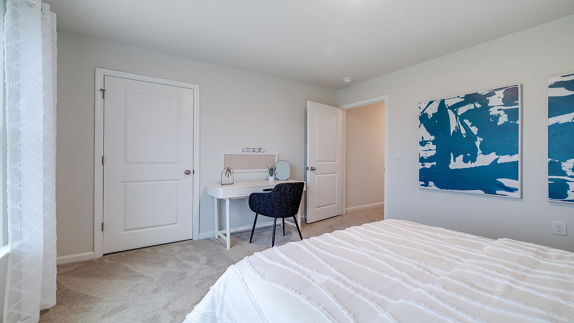 Secondary bedroom in Hayden floor plan with ample closet space and comfortable design for family or guests