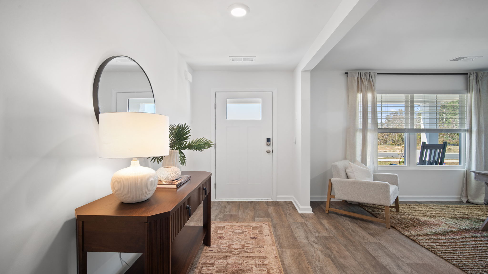 Welcoming foyer in the Hayden floor plan at Laurel Grove by D.R. Horton featuring open sightlines, abundant natural light, modern finishes, and seamless flow into the main living spaces.