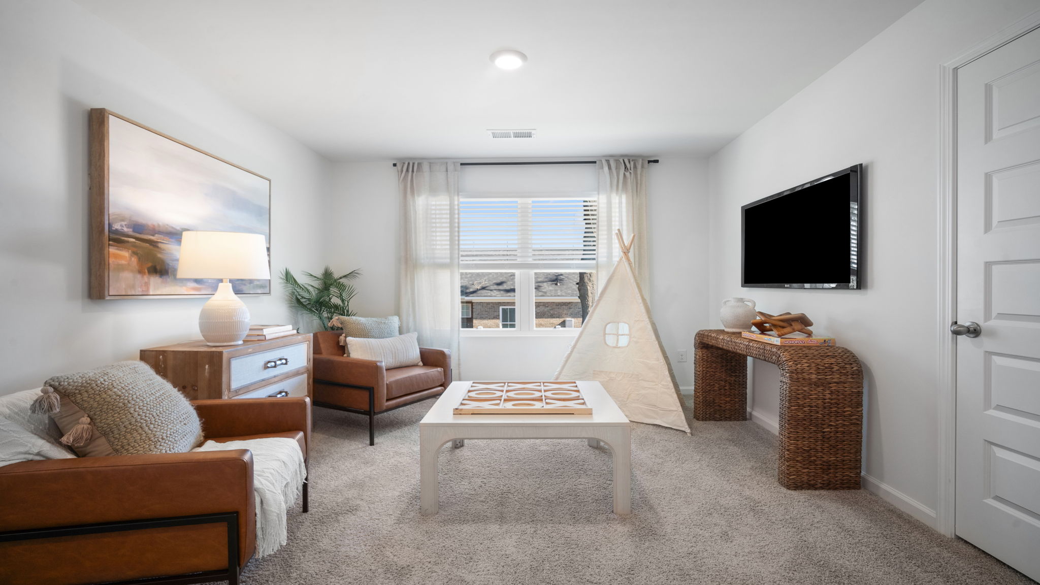 Bright upstairs loft in the Hayden floor plan by D.R. Horton in Laurel Grove showcasing flexible living space, modern finishes, and endless possibilities for entertainment, relaxation, or workspace needs.