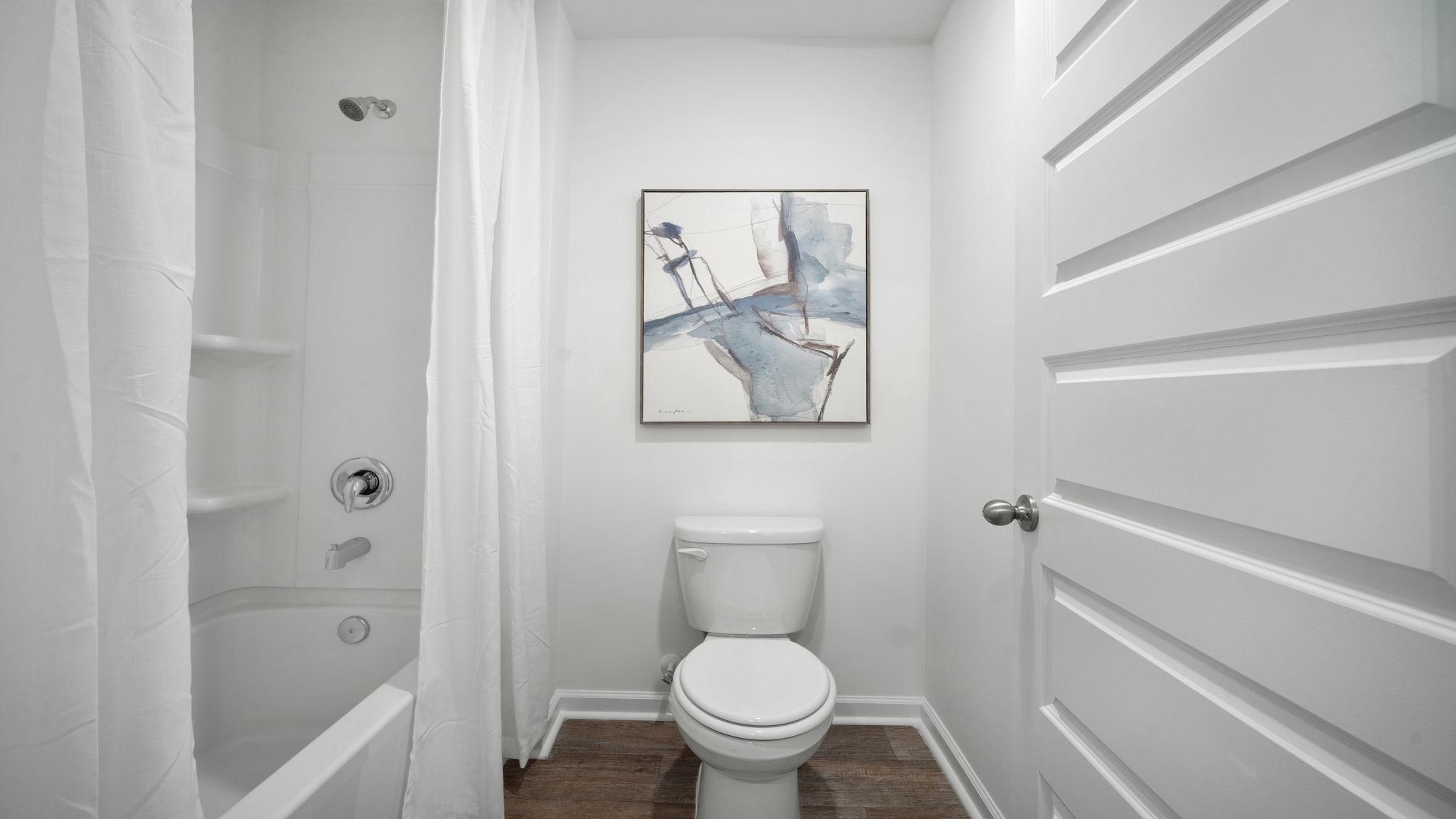 Bright guest bathroom in the Hayden floor plan by D.R. Horton in Laurel Grove showcasing stylish cabinetry, elegant lighting, and quality craftsmanship that combines comfort and convenience.