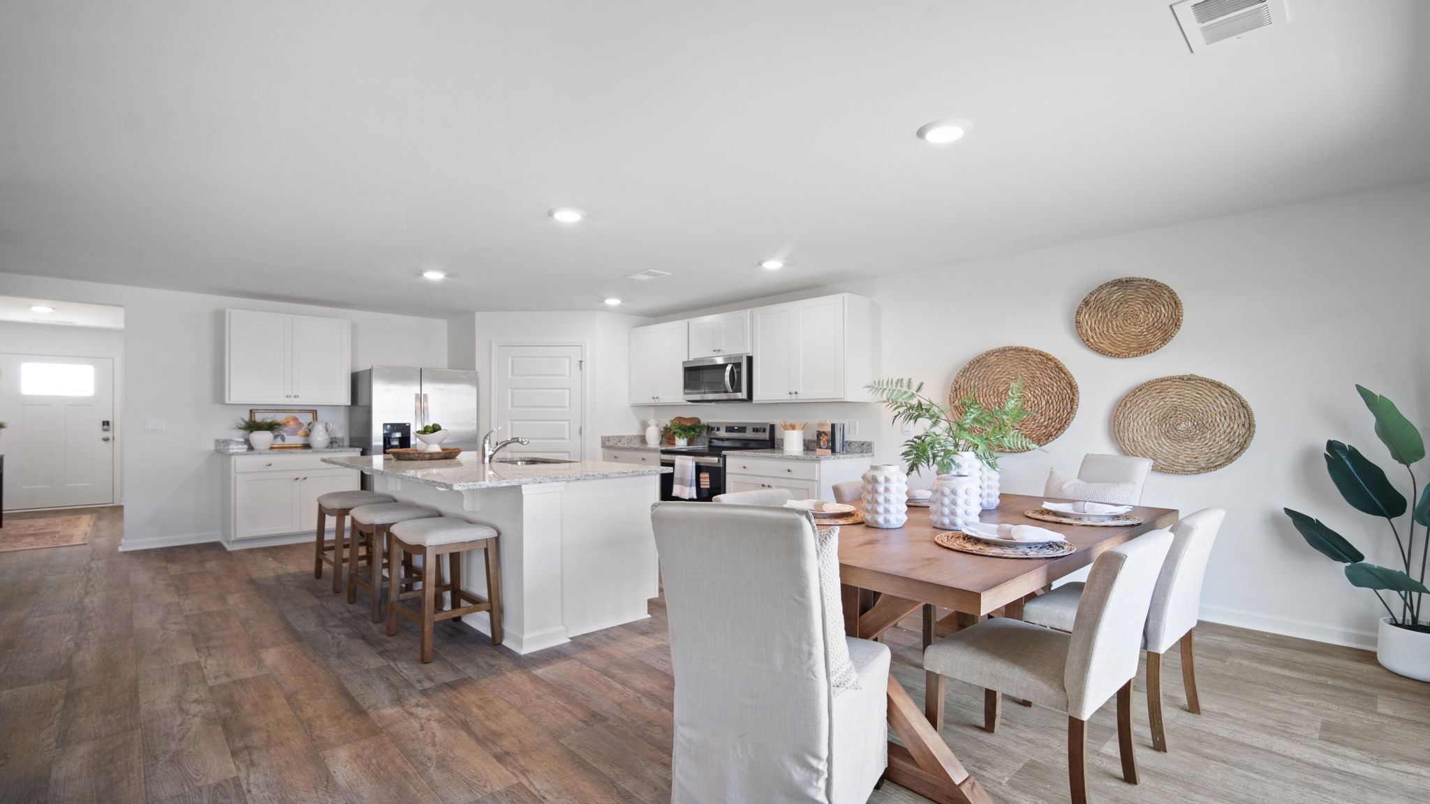 Bright dining room in the Hayden floor plan by D.R. Horton in Laurel Grove showcasing modern finishes, easy access to the kitchen, and a welcoming atmosphere for entertaining guests.