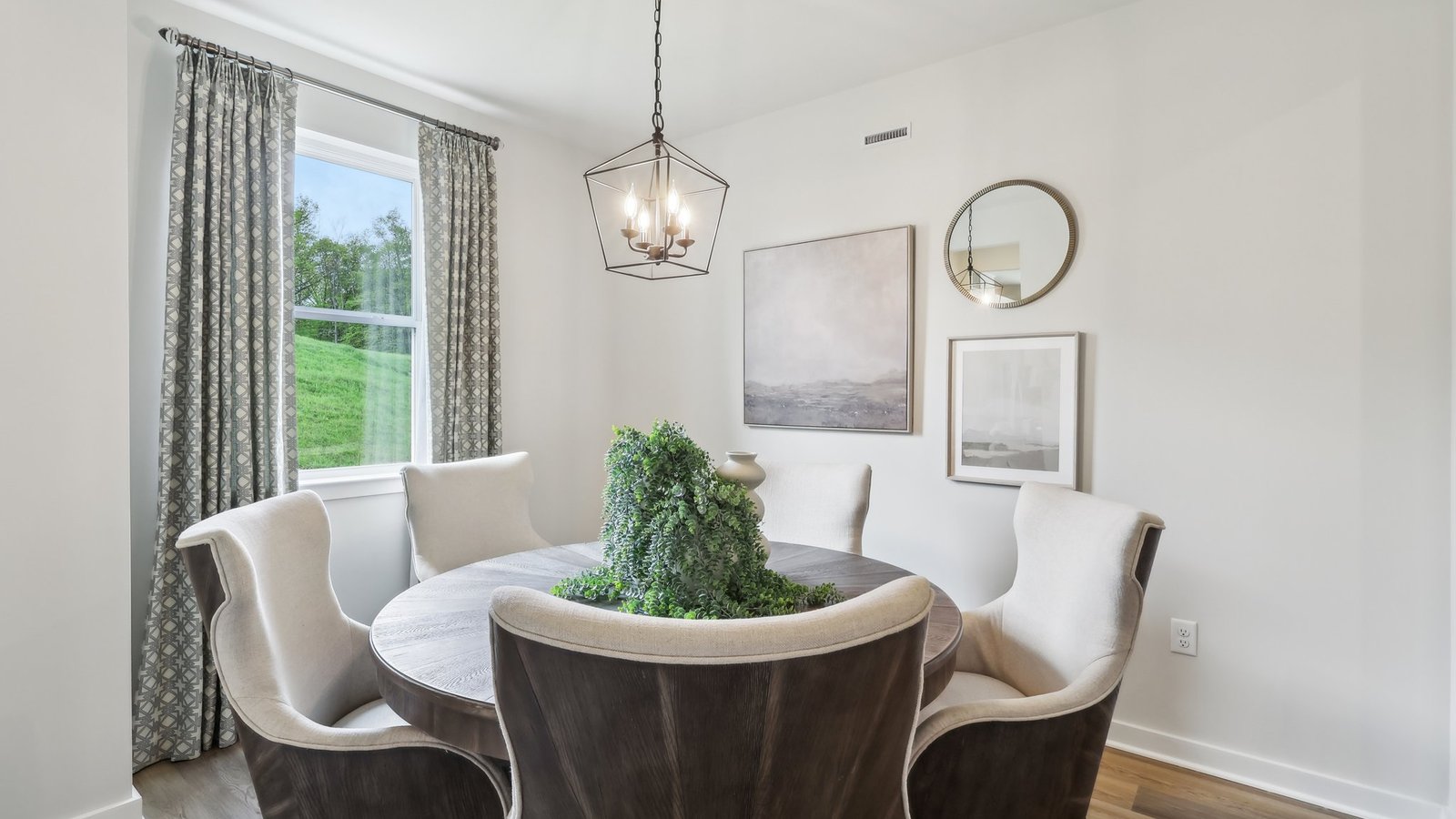 Spacious dining area adjacent to kitchen and family room, perfect for gatherings and holidays.