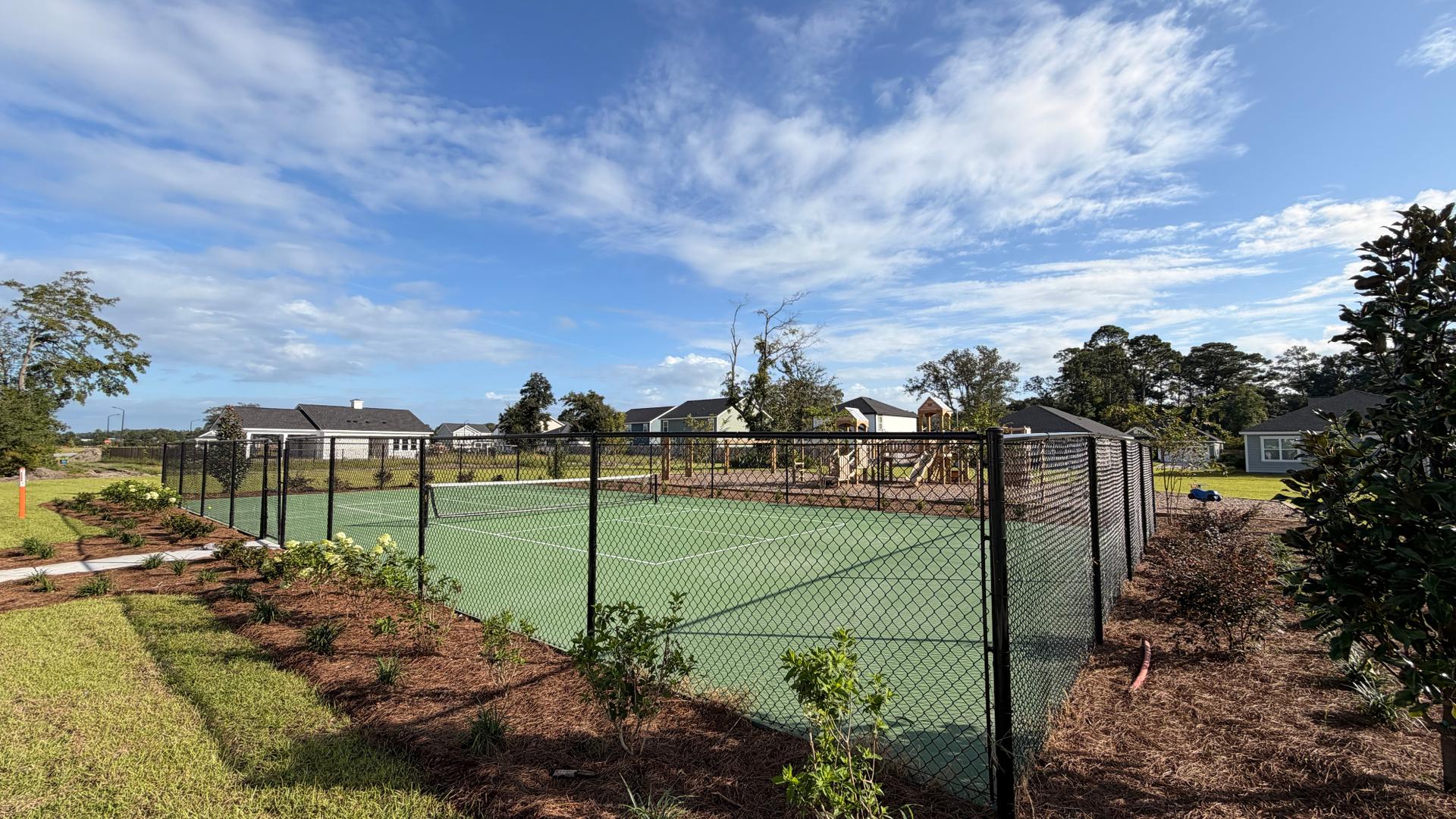 Laurel Grove pickleball courts with landscaped surroundings.