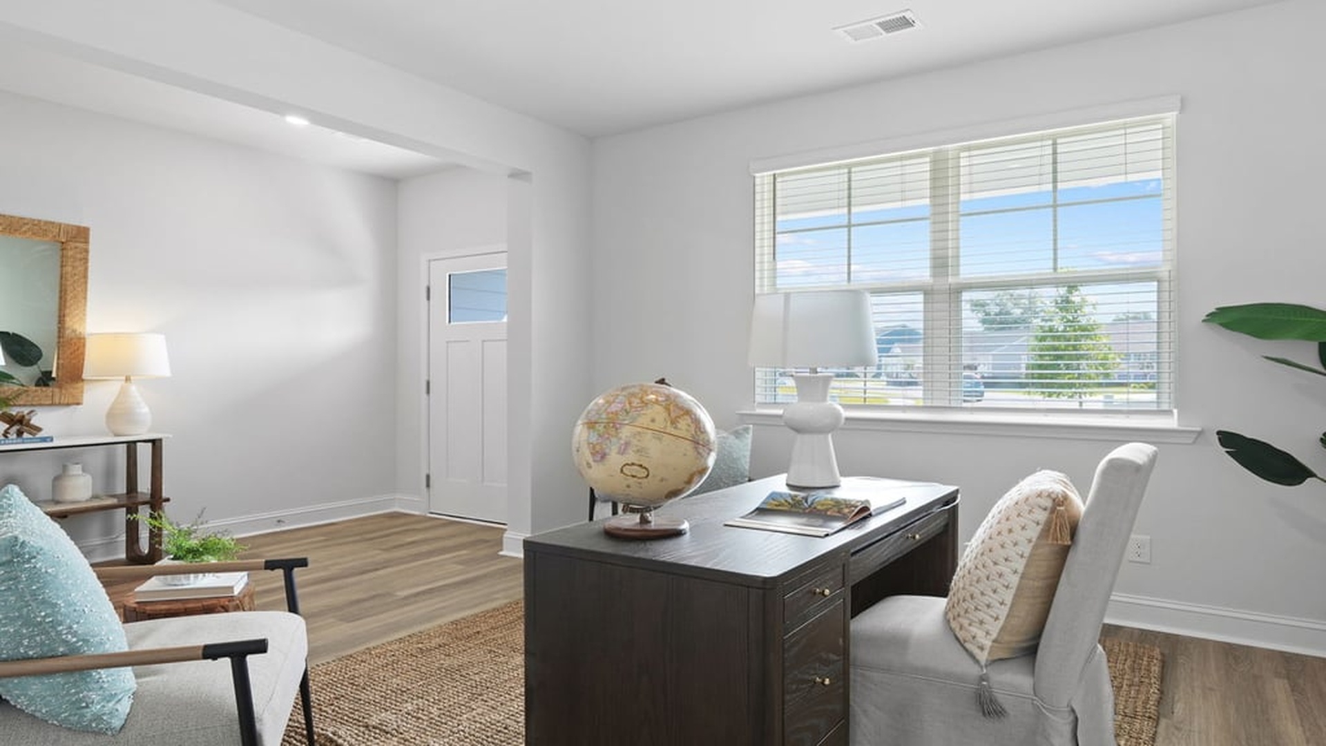 Versatile flex room in Harbor Oak floor plan perfect for home office, dining room, or study near welcoming foyer