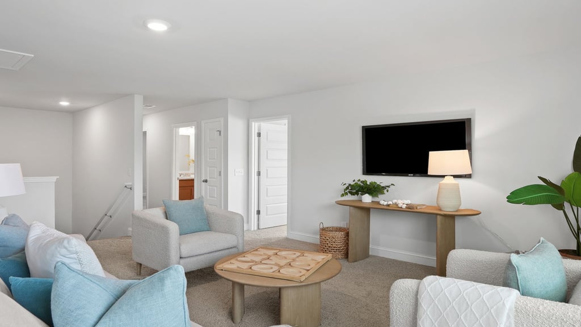 Open loft area connecting secondary bedrooms in DR Horton Harbor Oak home offering flexible lifestyle space