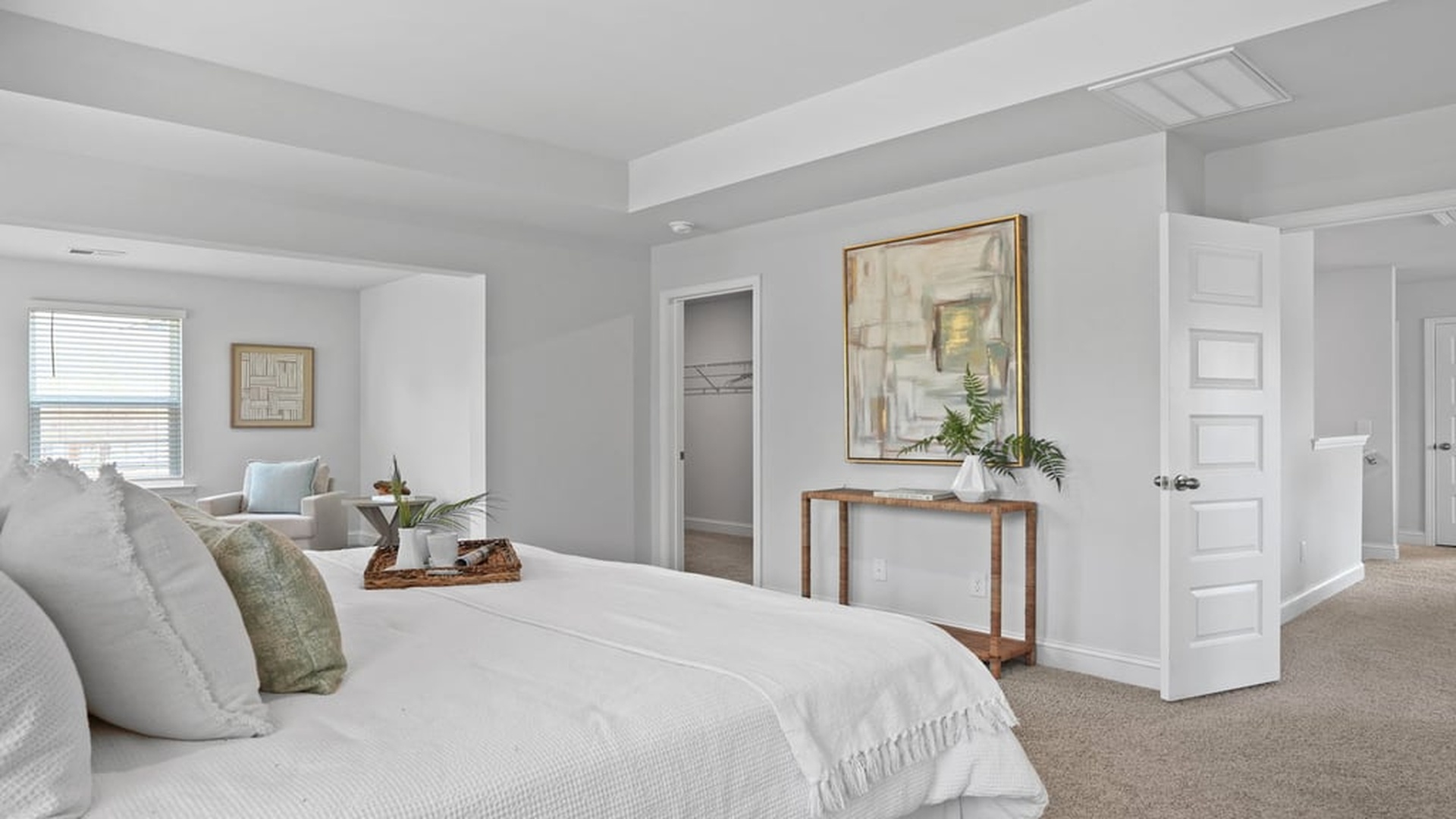 Spacious primary bedroom with natural light