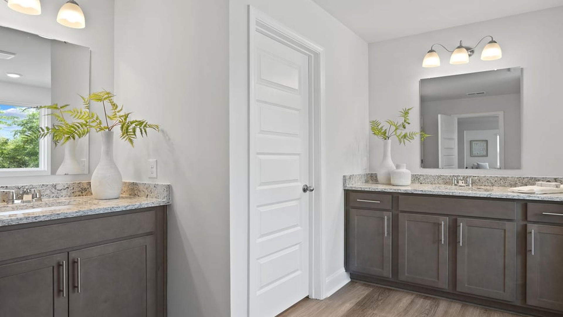 Owner’s suite with spa-inspired ensuite bath, dual vanities, walk-in shower, and generous closet space in Harbor Oak floor plan