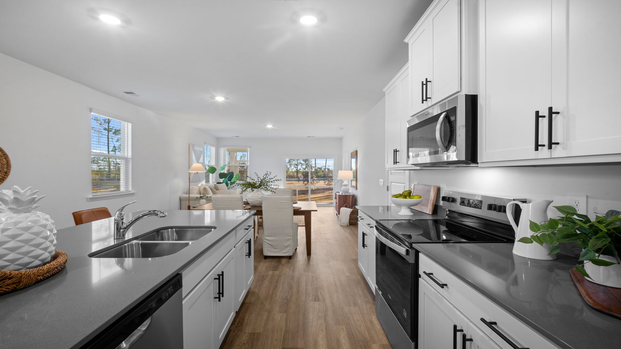 Kitchen walkway with counters on both sides