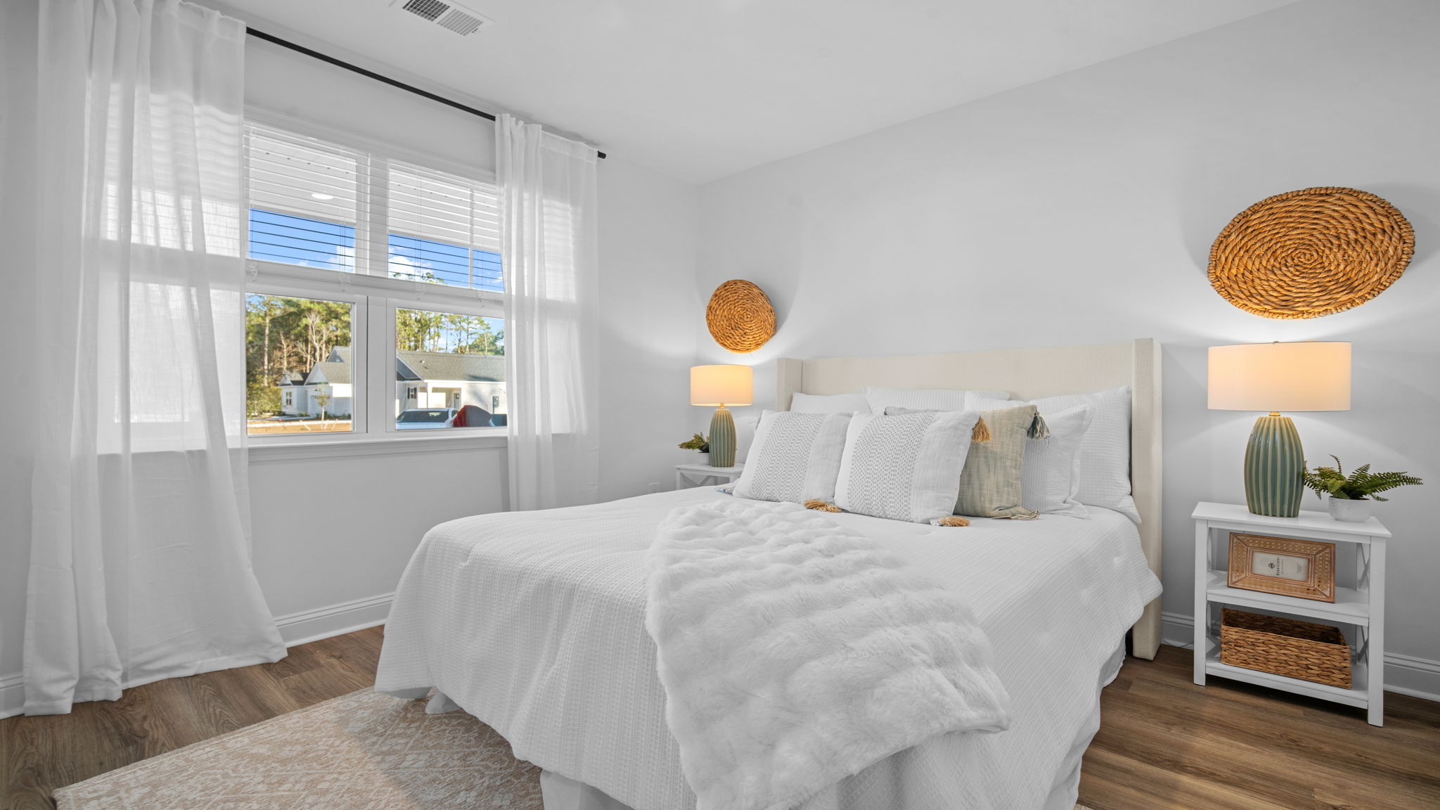Guest bedroom decorated with a bed and side table