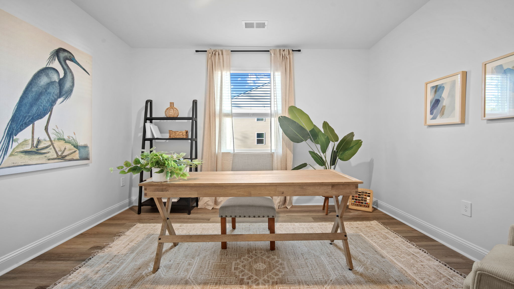 Guest bedroom decorated with a desk