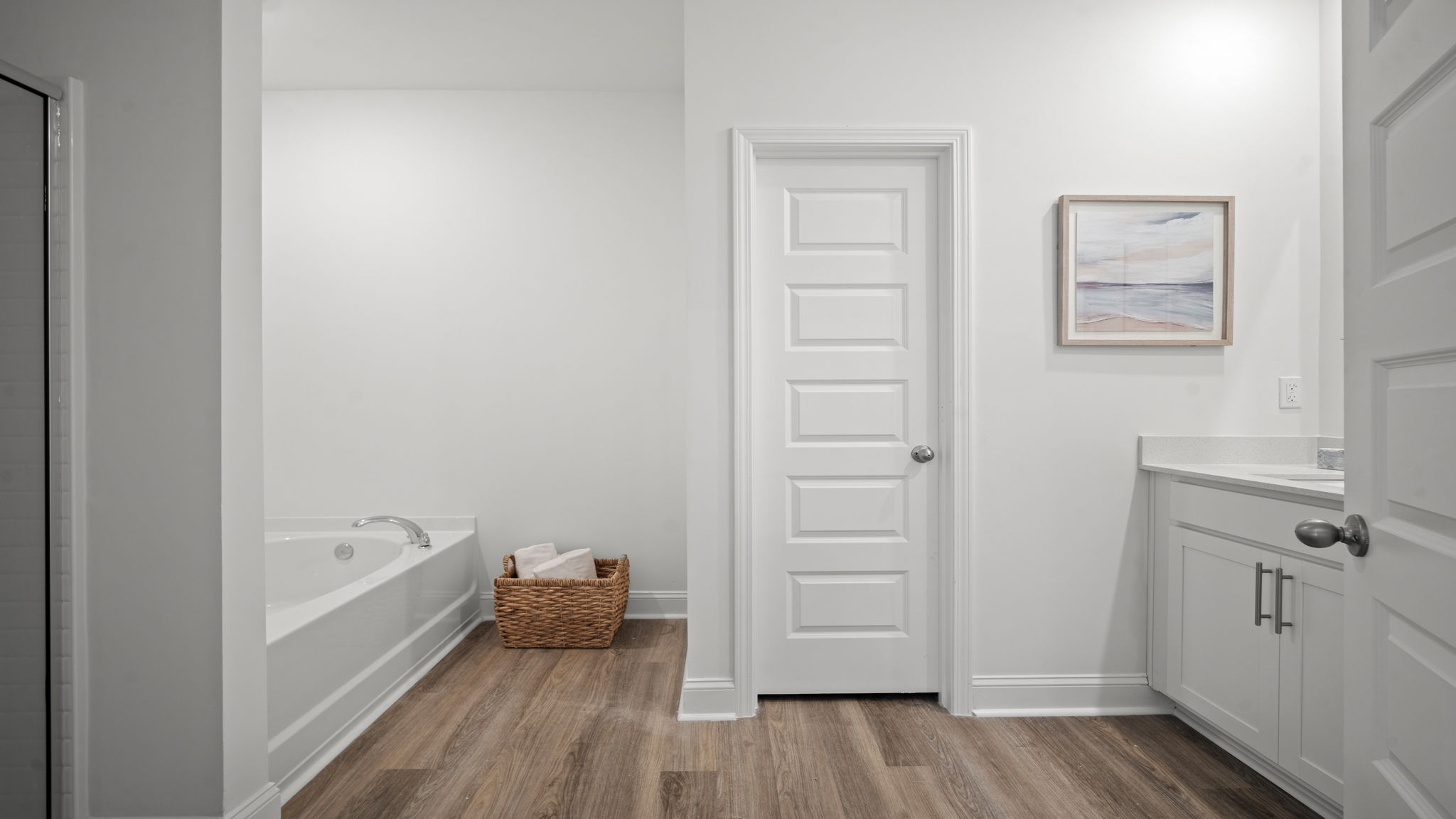 Primary bathroom with a tub and stand up shower