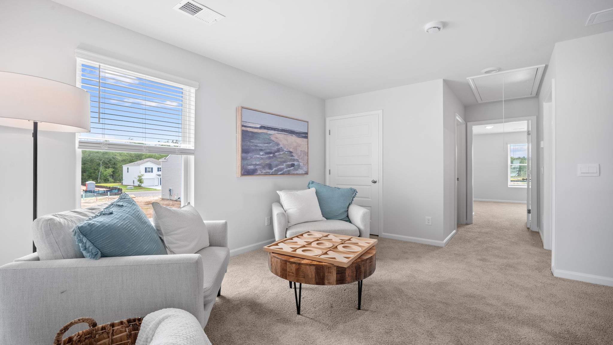 Upstairs loft decorated with two chairs and a table
