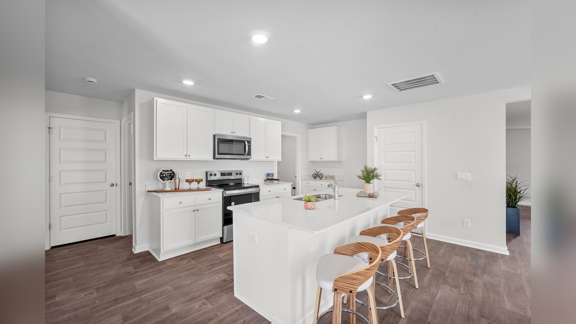 Kitchen view of the island with bar seating