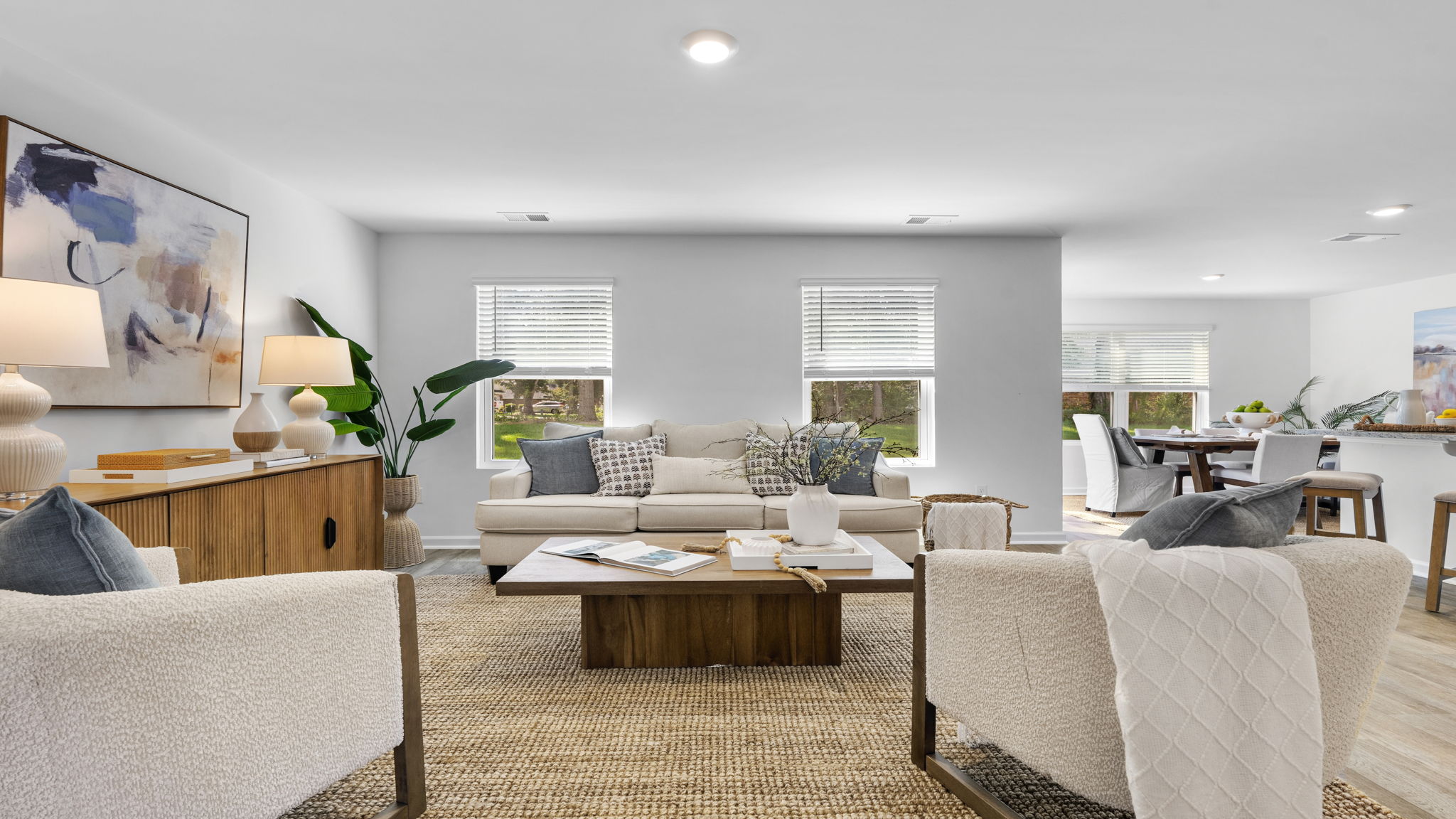 Open-concept family room in the Darwin home featuring comfortable seating and seamless flow to the kitchen.