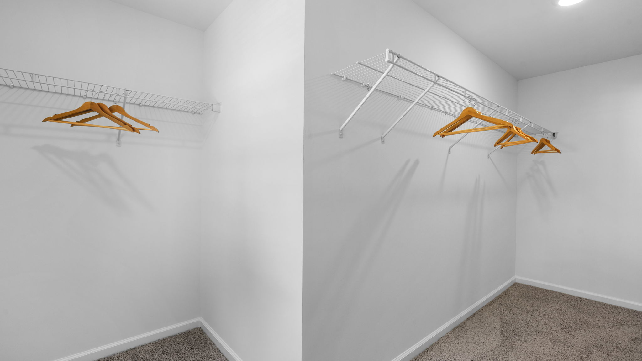 Large owner’s closet offering abundant storage and organization space.
