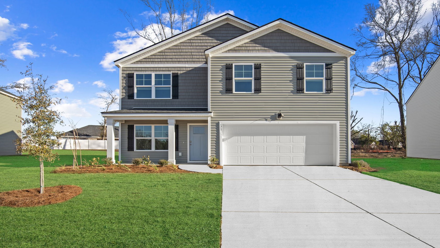 Belhaven floor plan exterior by D.R. Horton featuring attractive curb appeal, professional landscaping, energy-efficient construction, and a two-car garage.