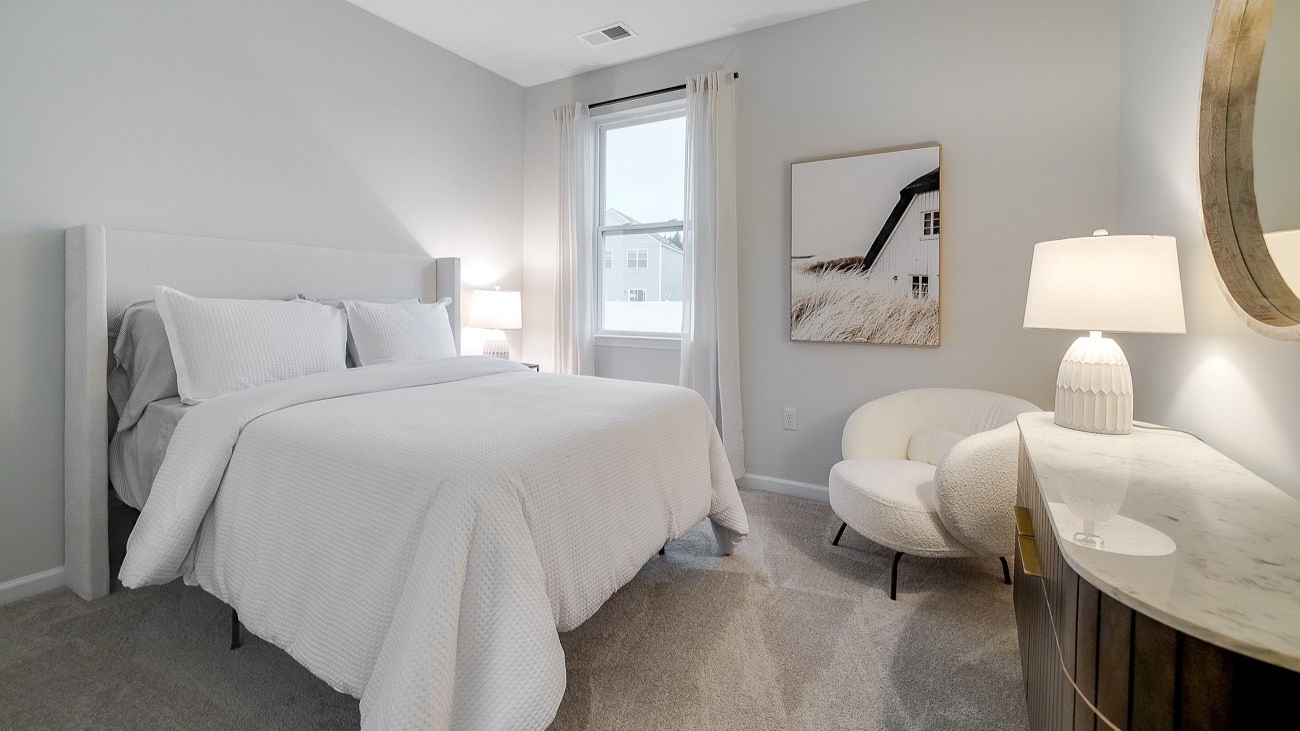 First-floor guest bedroom in Hayden floor plan with convenient access to full bathroom for guests or multi-generational living
