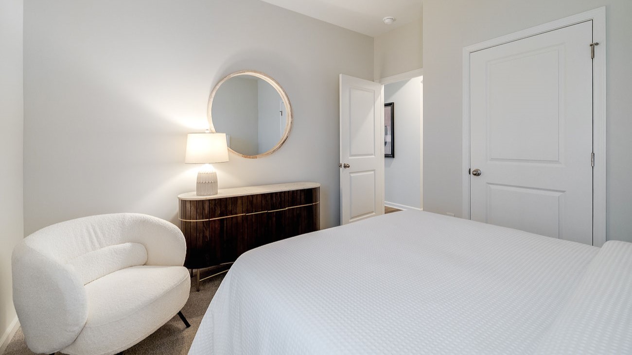 First-floor guest bedroom in Hayden floor plan with convenient access to full bathroom for guests or multi-generational living