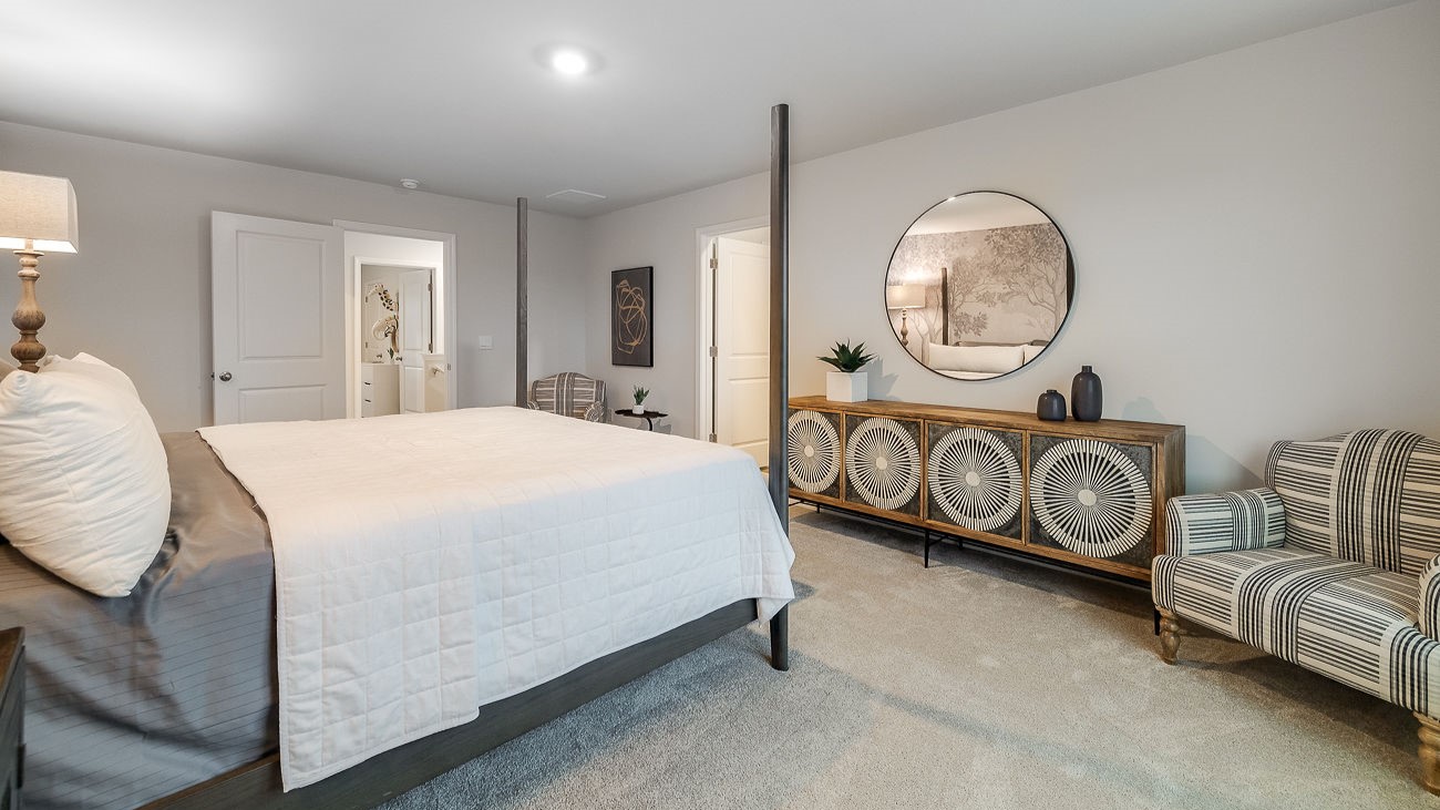 Spacious primary suite in Hayden floor plan with natural light and private retreat feel in Stockyard Statesboro GA