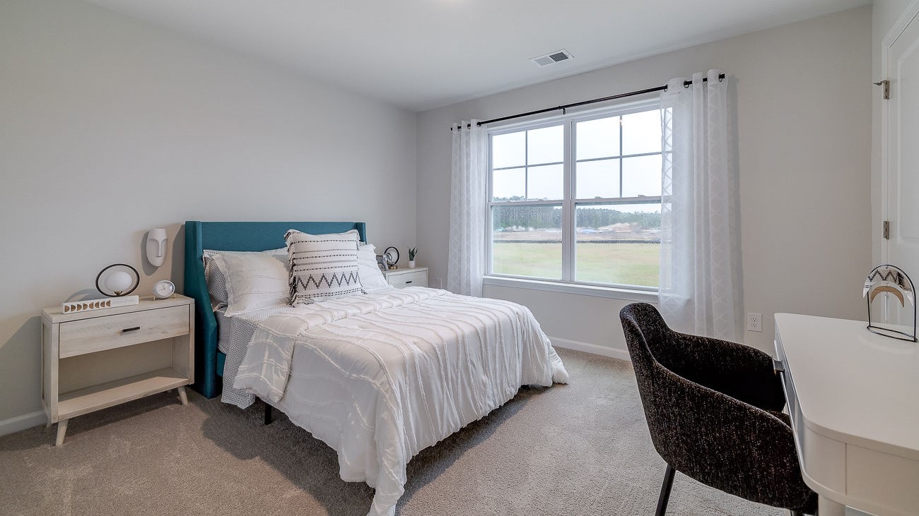 Secondary bedroom in Hayden floor plan ideal for guests, children, or home office in DR Horton Stockyard