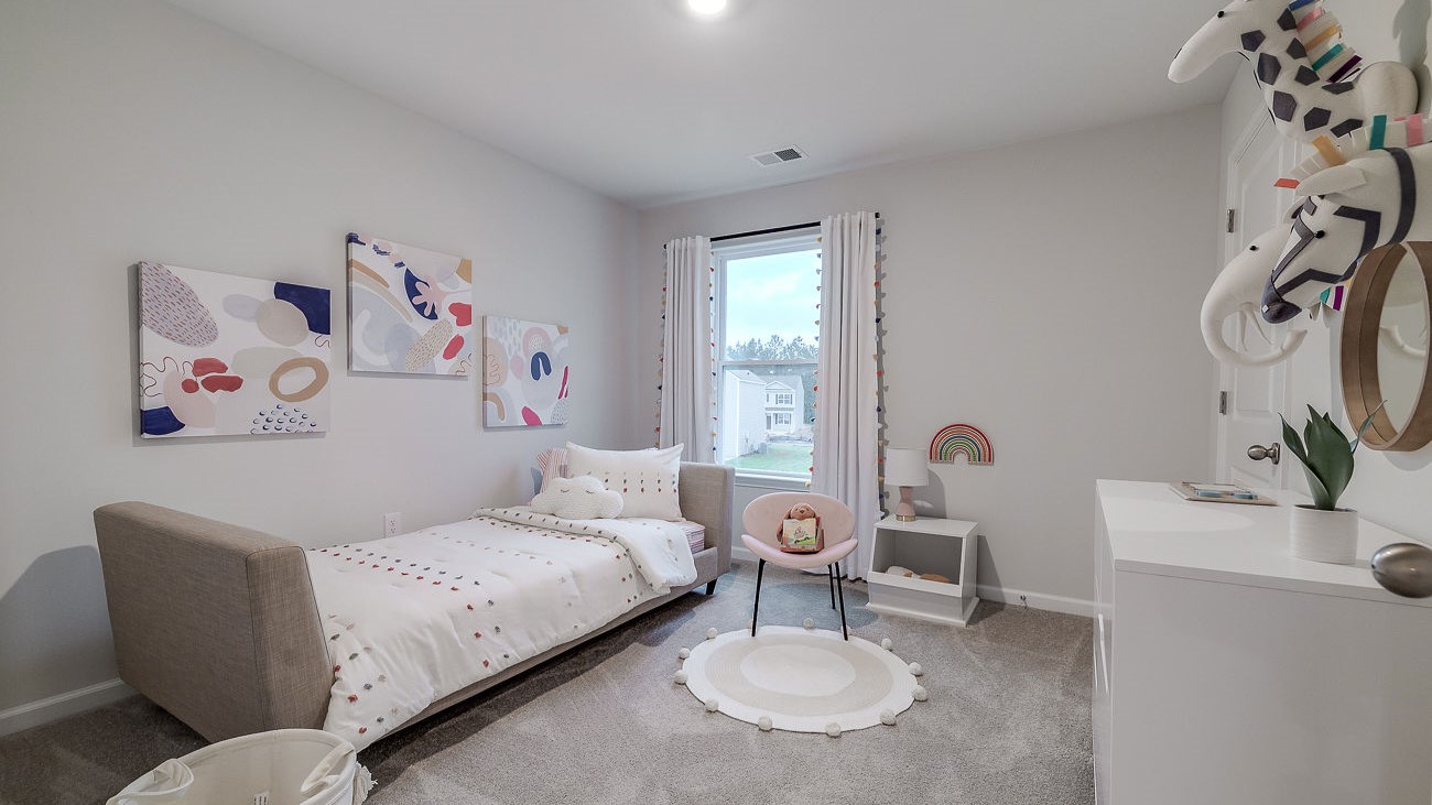 Secondary bedroom in Hayden floor plan ideal for guests, children, or home office in DR Horton Stockyard