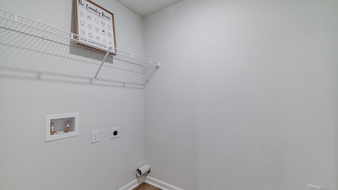 Convenient laundry room in Hayden DR Horton home located near bedrooms for efficient everyday living