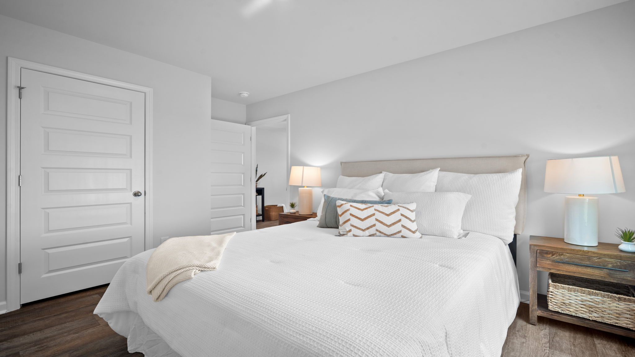 Guest bedroom decorated with a bed and side table