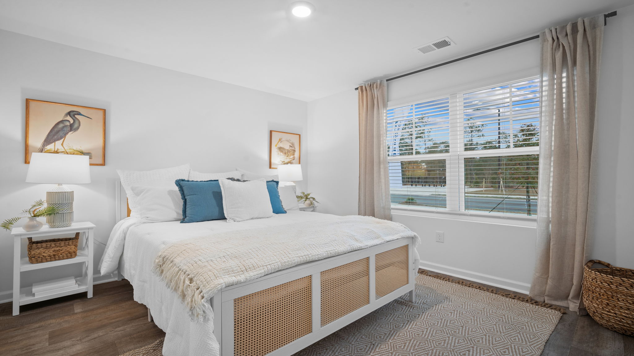 Guest bedroom with a bed and side table