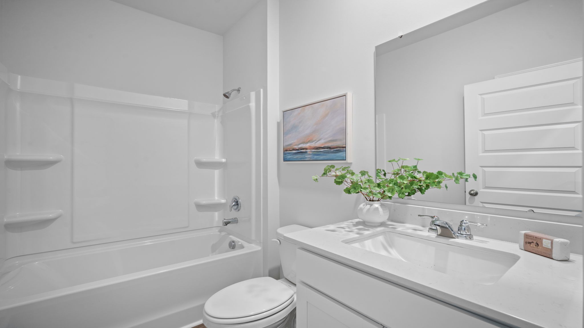 Guest bathroom with a tub shower