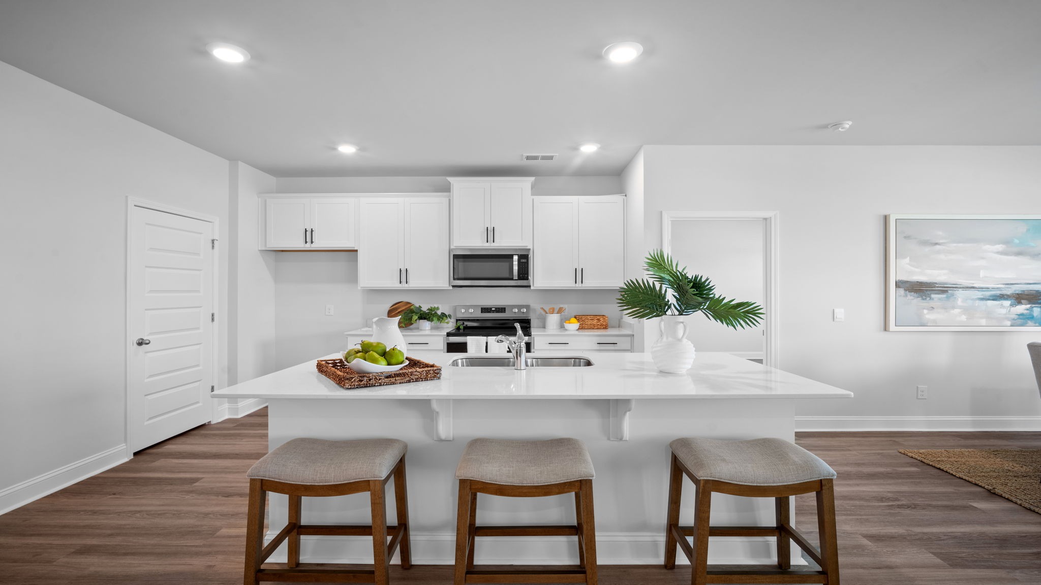 Kitchen with an oven range and a stainless dishwasher