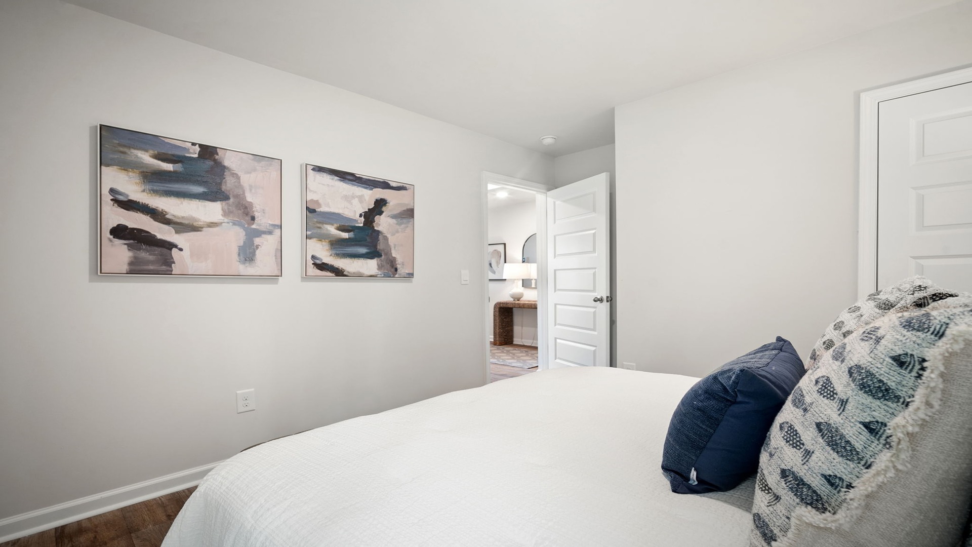Guest bedroom decorated with a bed and side table