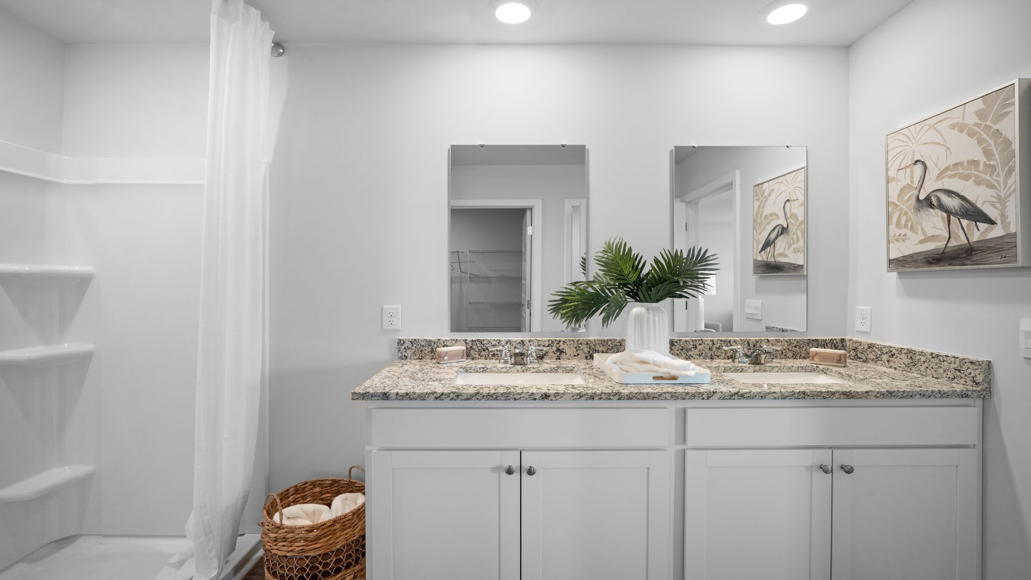 Spa-inspired owner's bath with modern fixtures and functional layout.