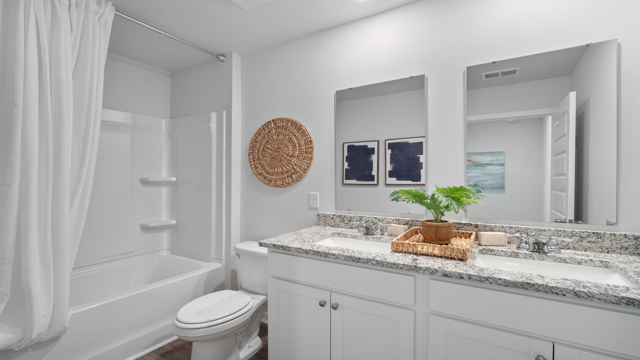 Full guest bathroom with modern fixtures conveniently serving secondary bedrooms.