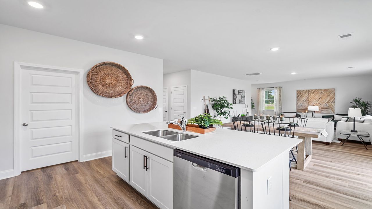 Large center island with seating, prep space, and storage in the heart of the Galen floor plan.