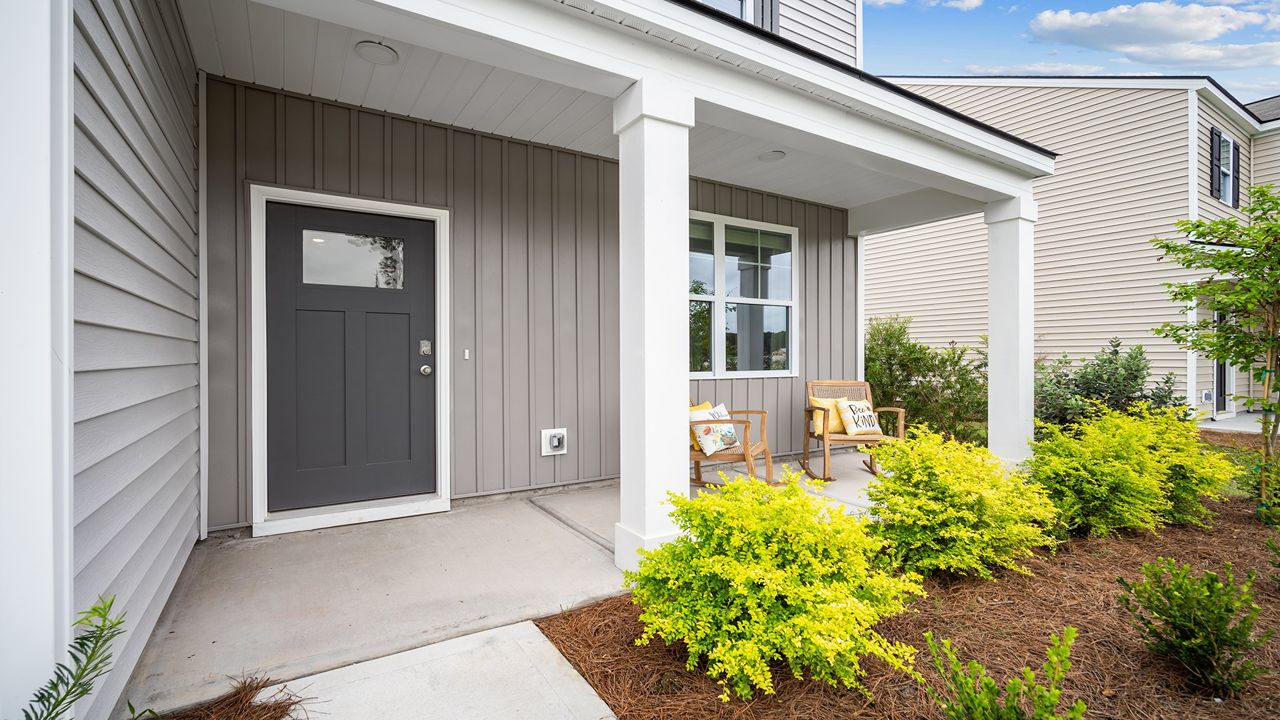Welcoming covered front porch perfect for relaxing and enjoying the Lowcountry lifestyle.