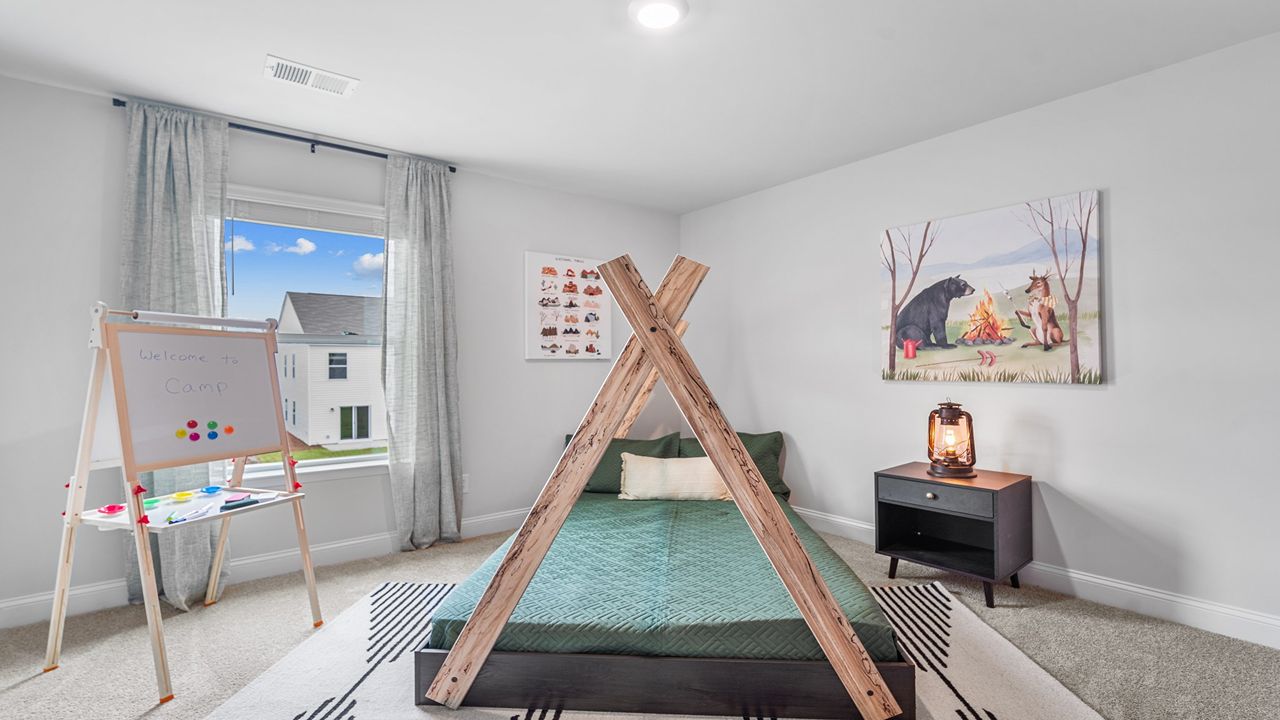Spacious secondary bedroom featuring modern finishes and abundant natural light.