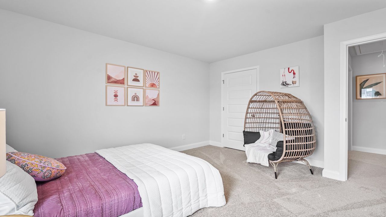Versatile bedroom with functional layout and ample storage.