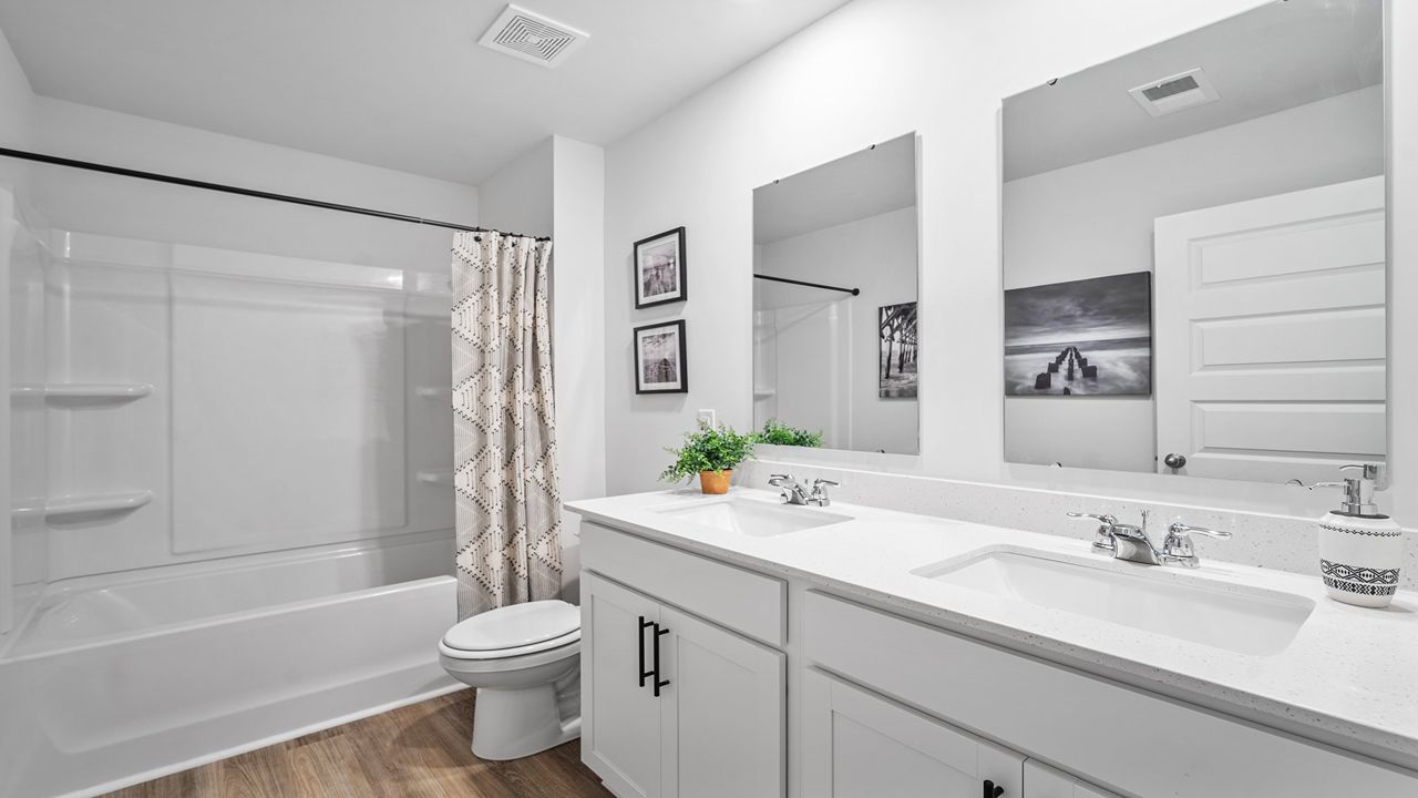 Full guest bathroom featuring contemporary fixtures and convenient access to secondary bedrooms.