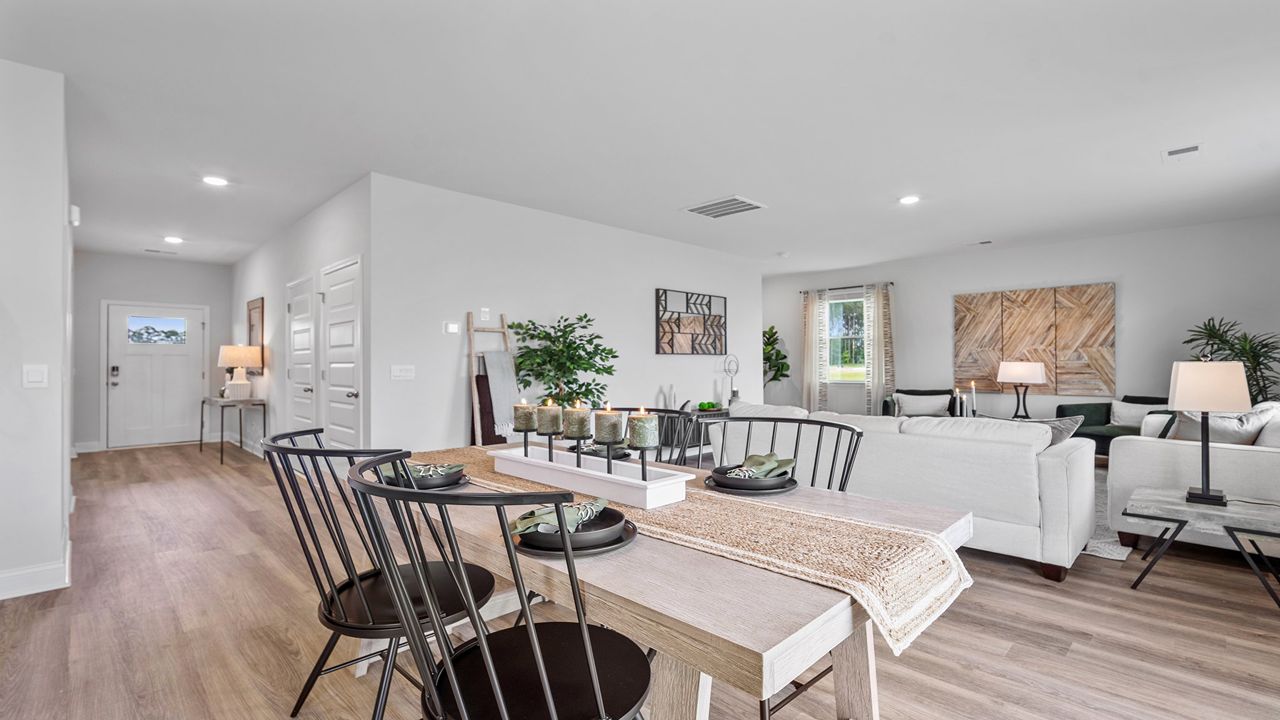Bright dining area seamlessly connected to the kitchen and family room for effortless entertaining.